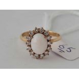 An opal and diamond cluster ring in 18ct gold size T 4.4g