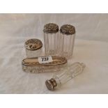 Four various silver top jars and a scent bottle with glass body (AF)