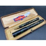 A CAMBRIDGE mottle pen and pencil set in Cambridge fitted case