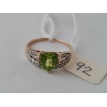 A green stone ring with diamond shoulders 9ct size T 2.5 gms