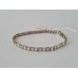 White stone set 9ct tennis bracelet 11.3g inc