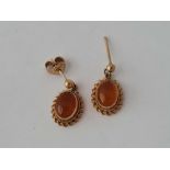 A pair of amber earrings 9ct