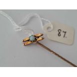 A opal set stick pin 15ct gold
