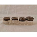 Four more circular jars embossed with glass bodies, 1.5" wide