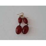 Antique red amber oval bead earrings on gold ear wires