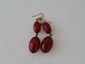 Antique red amber oval bead earrings on gold ear wires