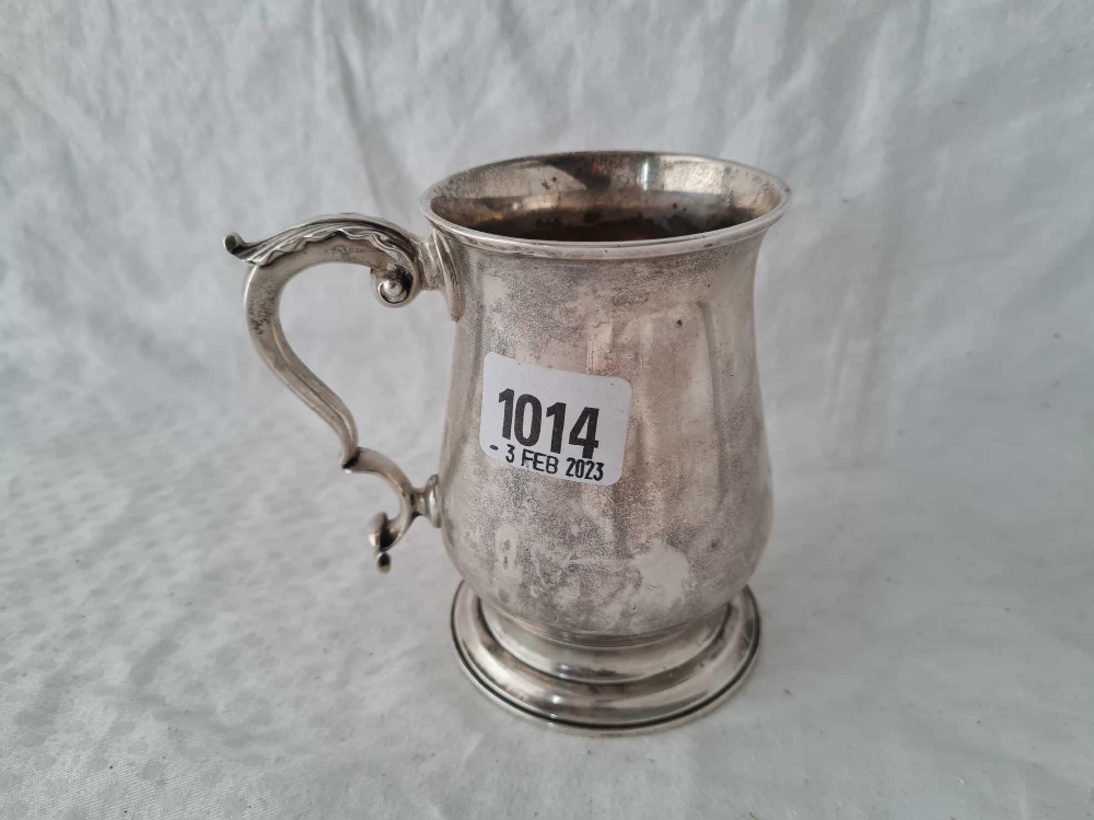 A heavy early George III half pint tankard with leaf capped handles 4 ½ inches high London 1765 by I