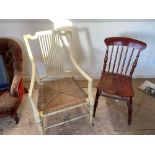 A painted rush seated elbow chair and a kitchen chair