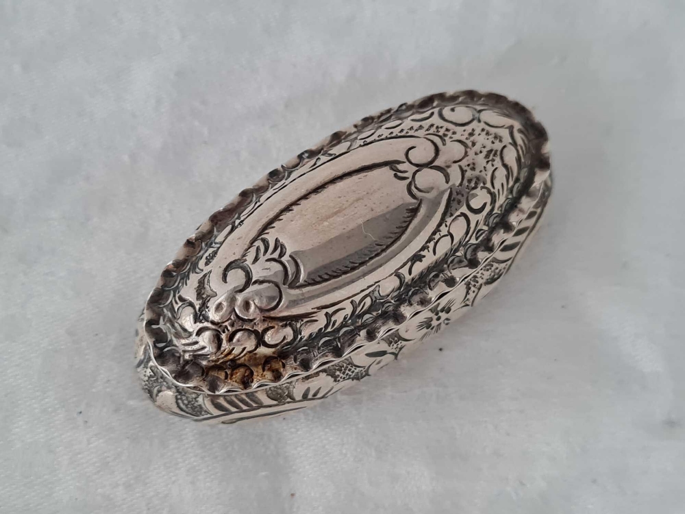An oval pill boxed embossed, hinged cover, 2" wide, Birmingham 1897 - Image 2 of 4