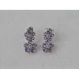 Diamond and tanzanite flower earrings in 10k 1.4g inc