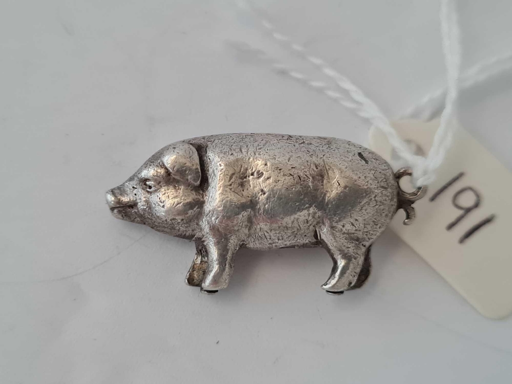 A silver pig pendant