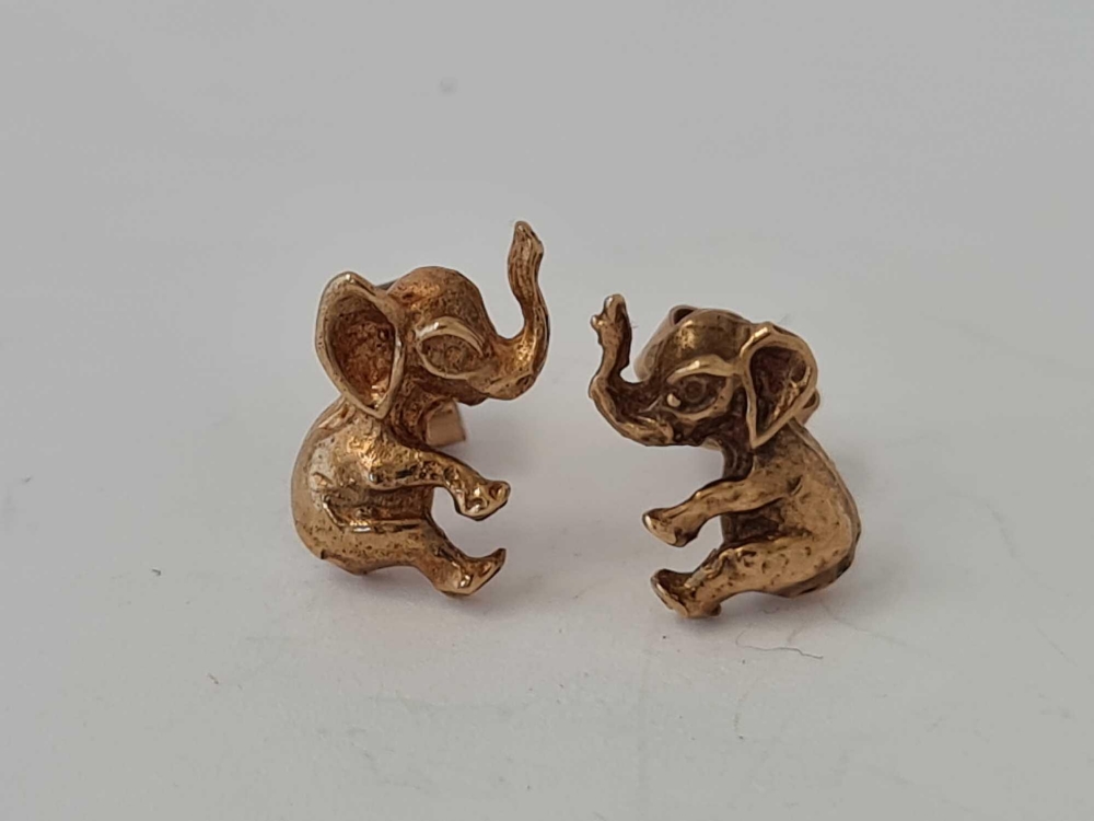 A pair of elephant design earrings 9ct