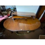 A good quality mahogany large dining table with three leaves standing on claw and ball feet