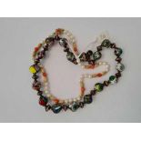 A string of pearl and coral beads with 9ct clasp and string of porcelain beads
