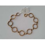 A ANTIQUE EIGHT CIRCULAR LINK BRACELET 9CT 7.5 INCH 12.3 GMS