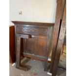 A Jacobean oak bedstead with carved panel end and wood supports