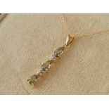 A peridot and diamond 9ct necklace 1.6g inc