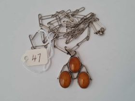 A Vintage stylish yellow amber pendant and chain