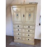 A painted Adams style linen press with a Wedgwood panel on the to doors, five drawers under, 6ft