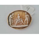 A antique oval cameo brooch depicting a early Roman scene set in gold