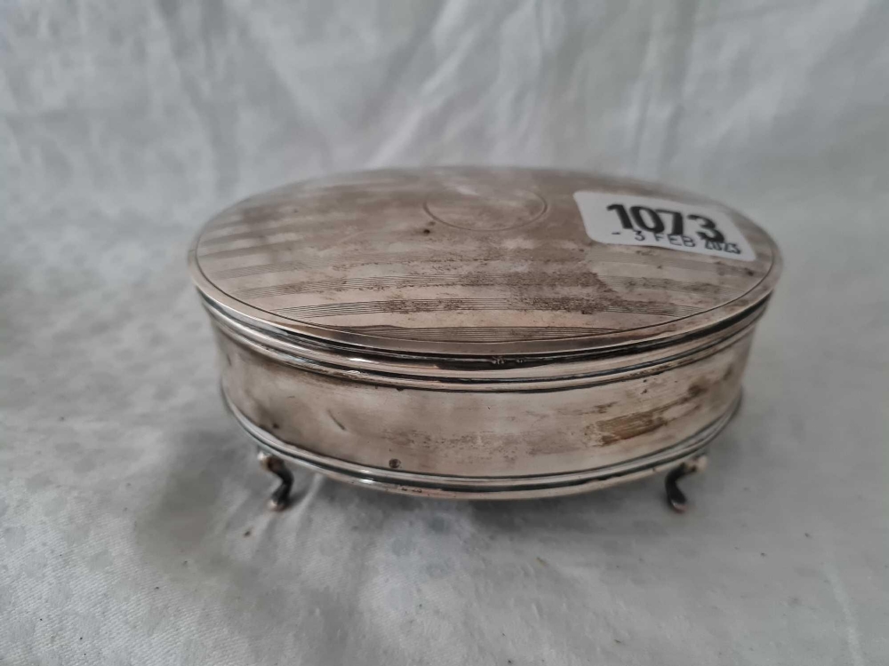 An oval Jewellery box standing on four pad feet, 4.5" wide, Birmingham 1922