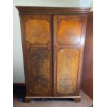 A George III , 4ft 3" wide style mahogany wardrobe with two panel doors, the interior with drawers