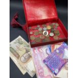 Box of coins and banknotes