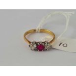 Ruby and diamond three stone ring 18ct size O. 2.4gms
