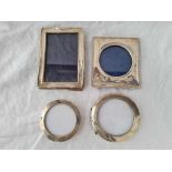 Two circular photo frames and two others