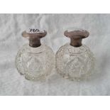 A pair of circular scent bottles with screw on covers to cut glass bodies, 3. 3/4" high,