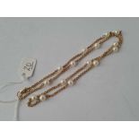 AN ATTRACTIVE 22” LONG PEARL and 9ct necklace 12g inc