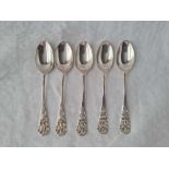 A heavy set of four bottom marked tea spoons the backs with shell motif, 93g