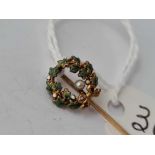 A gold emerald & pearl stick pin