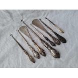 Eight various button hooks, shoe horns etc with silver handles