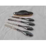 A silver nail buffer, four silver mounted implements, Birmingham 1919