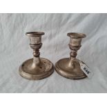 A pair of candlesticks with baluster shaped stems, 4" high, Birmingham 1954