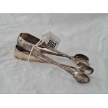 Two pairs of sugar tongs, one 1890