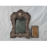 Two photo frames, one with embossed borders, 9" high, Chester 1901