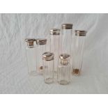 Seven silver top jars with glass bodies, London 1894 etc