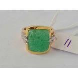 A diamond and jade ring 14ct gold size N 7.8 gms