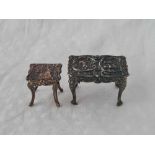 A miniature writing table with chased decoration, 1 3/4" wide, London and another similar but