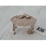 A miniature Continental silver table with chased decoration, 2" wide, Birmingham 1950