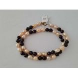 A pretty antique pearl and faceted garnet bead necklace 20 inch