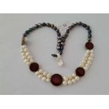 A fancy black and white pearl necklace