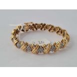 A Diamond set bracelet 9ct 23 gms