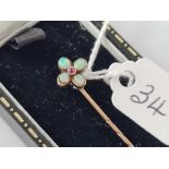 A Victorian opal and ruby stick pin with swivel top in high carat gold on 9ct pin boxed