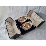 A boxed pair of oval sauce boats with gadroon rims, each on pad feet, 6" wide, London 1916, 187g