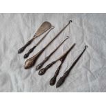 Six silver handled button hooks etc