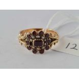 A antique garnet and pearl ring set in gold size T 3.7 gms