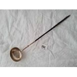 A Georgian toddy ladle with oval crested bowl, whale bone handle